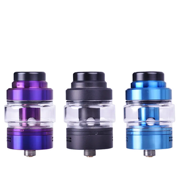 Three Vandy Vape Kylin M Pro RTA tanks in purple, black, and blue against a white background.