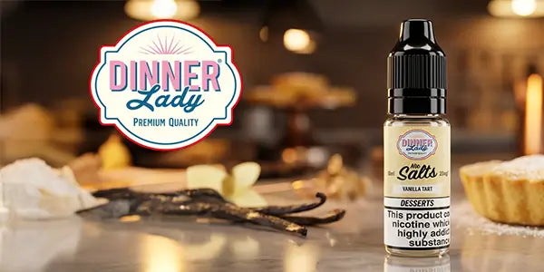 Dinner Lady Nic Salts Vanilla Tart dessert flavor e-liquid in a 10ml bottle next to fresh vanilla beans.