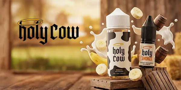 Holy Cow e-liquid display featuring Banana Milkshake 100ml shortfill and Holy Smokes Creamy Tennessee Bourbon nicotine salt bottles with milk splashes, banana slices, and miniature barrels.