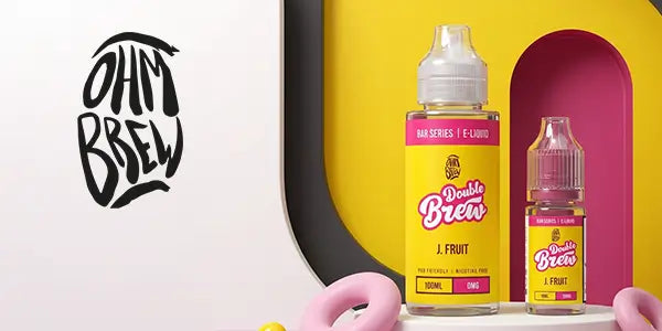 Ohm Brew Double Brew Bar Series J. Fruit e-liquid in 100ml shortfill and 10ml nicotine salt bottles on a vibrant yellow and pink background.