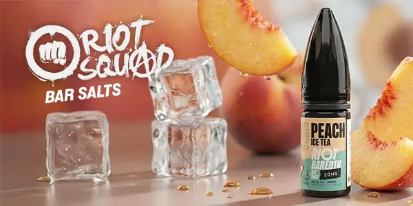 Riot Squad Peach Ice Tea bar salt with ice cubes and peach slices on a wooden surface.