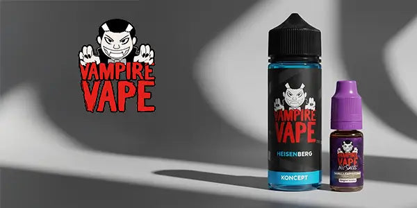 Vampire Vape Heisenberg Koncept 100ml shortfill and a 10ml nicotine salt bottle shown with the red Vampire Vape logo on a grey background with dramatic shadows.