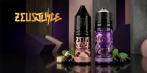 Zeus Juice e-liquid display featuring Phoebe Luxury Cheesecake nicotine salt and Black Reloaded 100ml shortfill bottles with blackcurrant and mint leaf accents.