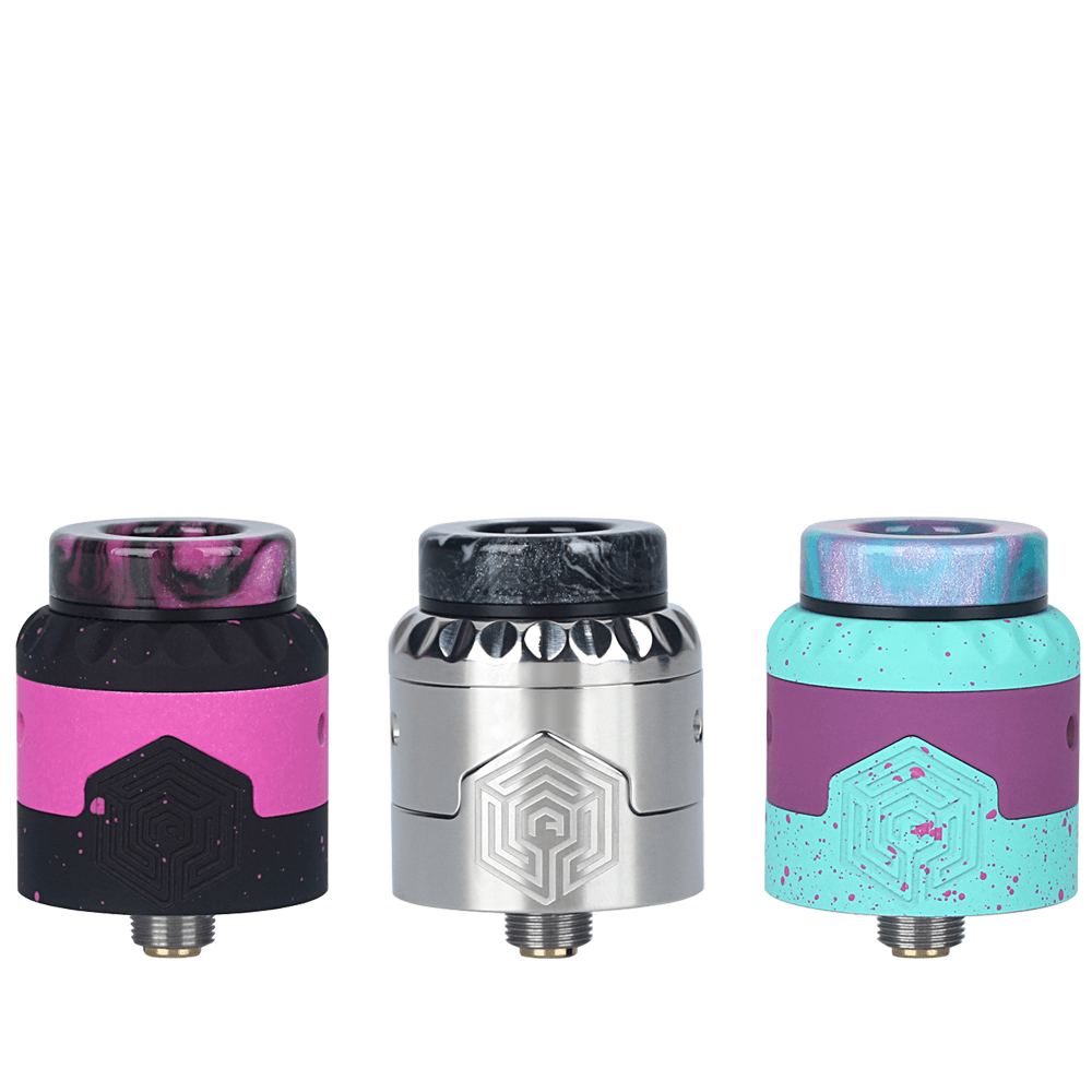 Three Advken Artha Gen 2 RDAs in black, silver, and turquoise with unique designs.