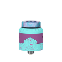 Advken Artha Gen 2 RDA in turquoise and purple with a speckled design.