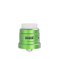 Green Damn Vape Nitrous RDA with dual cap, side airflows, and white drip tip.