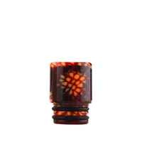 Red and orange patterned drip tip with a floral design.