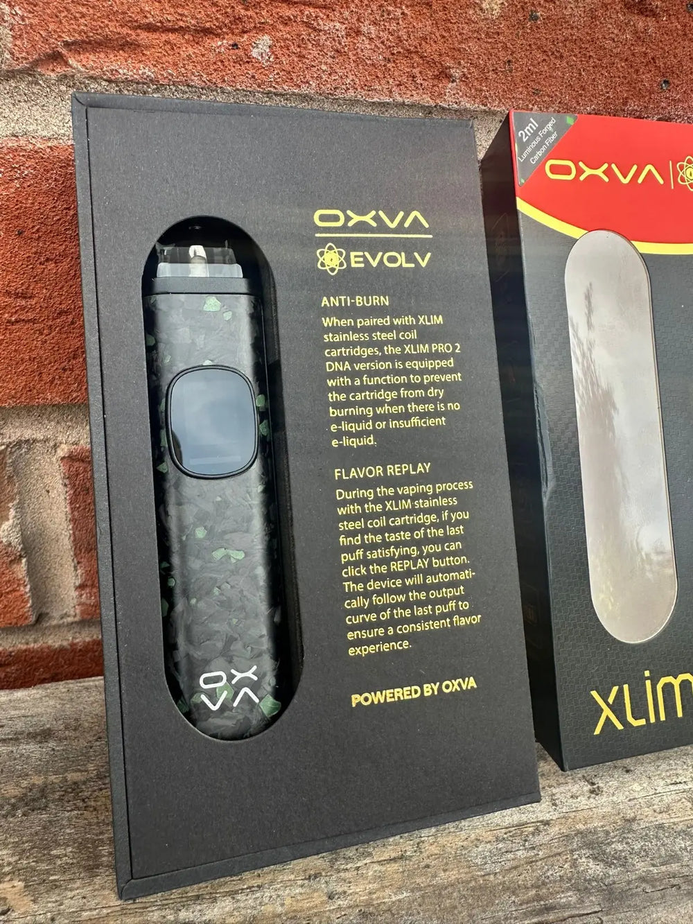 OXVA Xlim Pro 2 DNA Pod Vape Kit with Elolv dna chip - in inner packaging dispaying Anti Burn Text and Flavour Replay text 