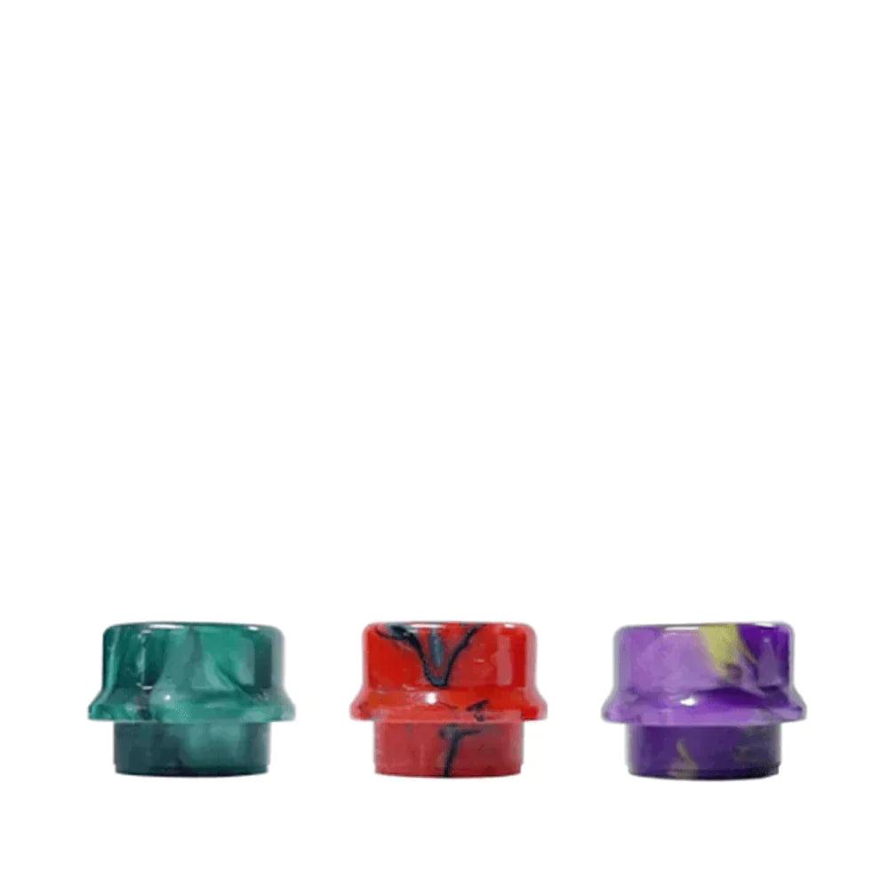 Three colourful small-bore 810 drip tips in green, red, and purple.