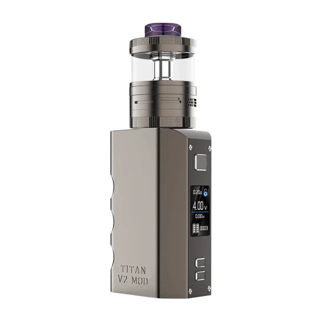 A Steam Crave Titan V2 Combo Vape Kit in gunmetal finish, featuring a robust box mod with a digital display and an RDTA tank on top. The tank has a purple drip tip and clear glass, while "Titan V2 Mod" is engraved on the device's side.