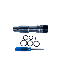 Vape RBA kit with metal components, O-rings, and a blue screwdriver.