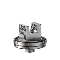 Silver RTA vape tank component with a detailed airflow design.