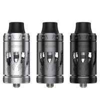 Three Lindwurm RTA vape tanks in silver, grey, and black with intricate designs.